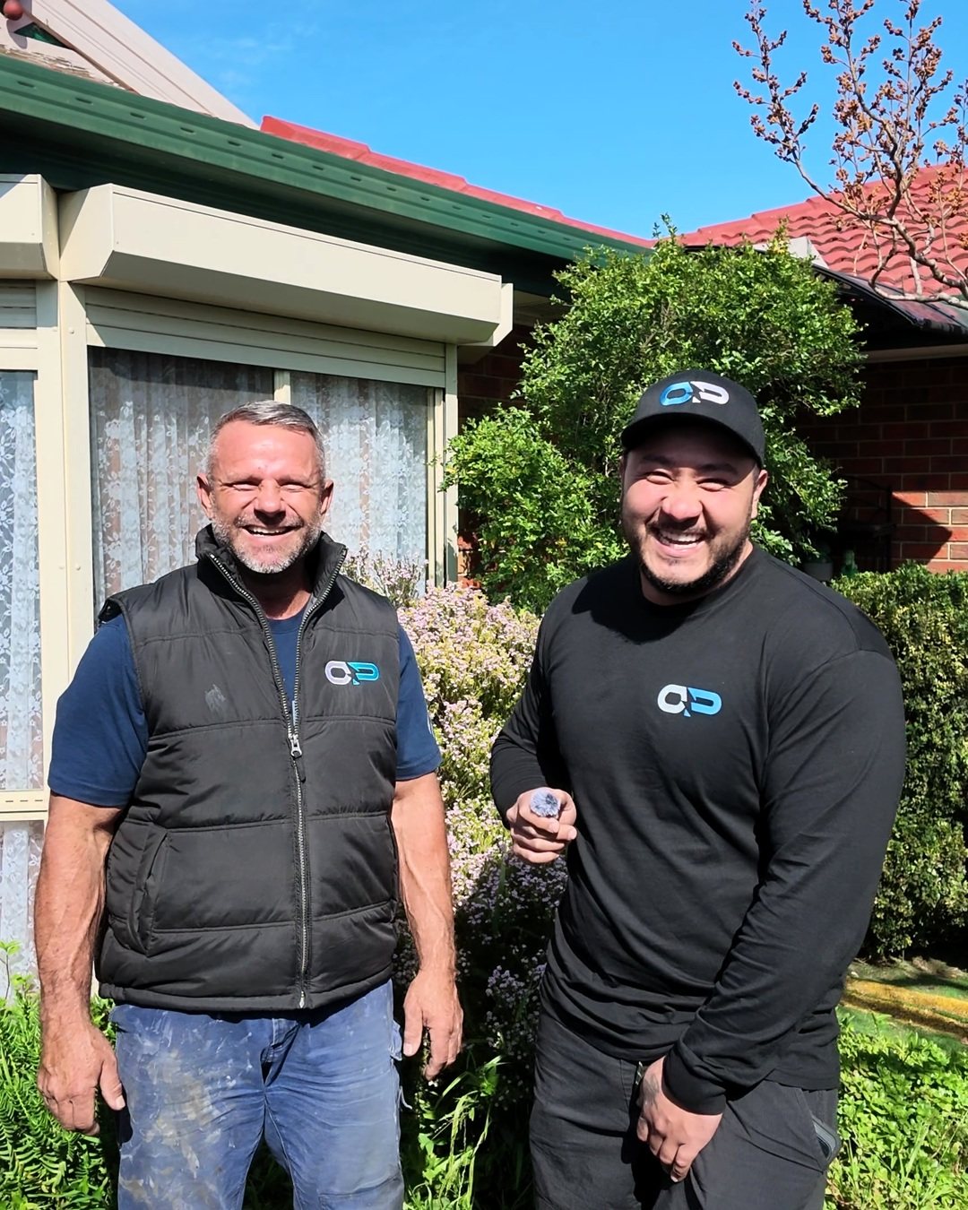 Rob Kramer and Peter Orlando outside a Melbourne home